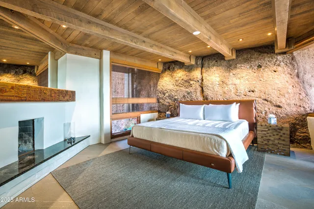 a bathroom with a double vanity sink and large mirror