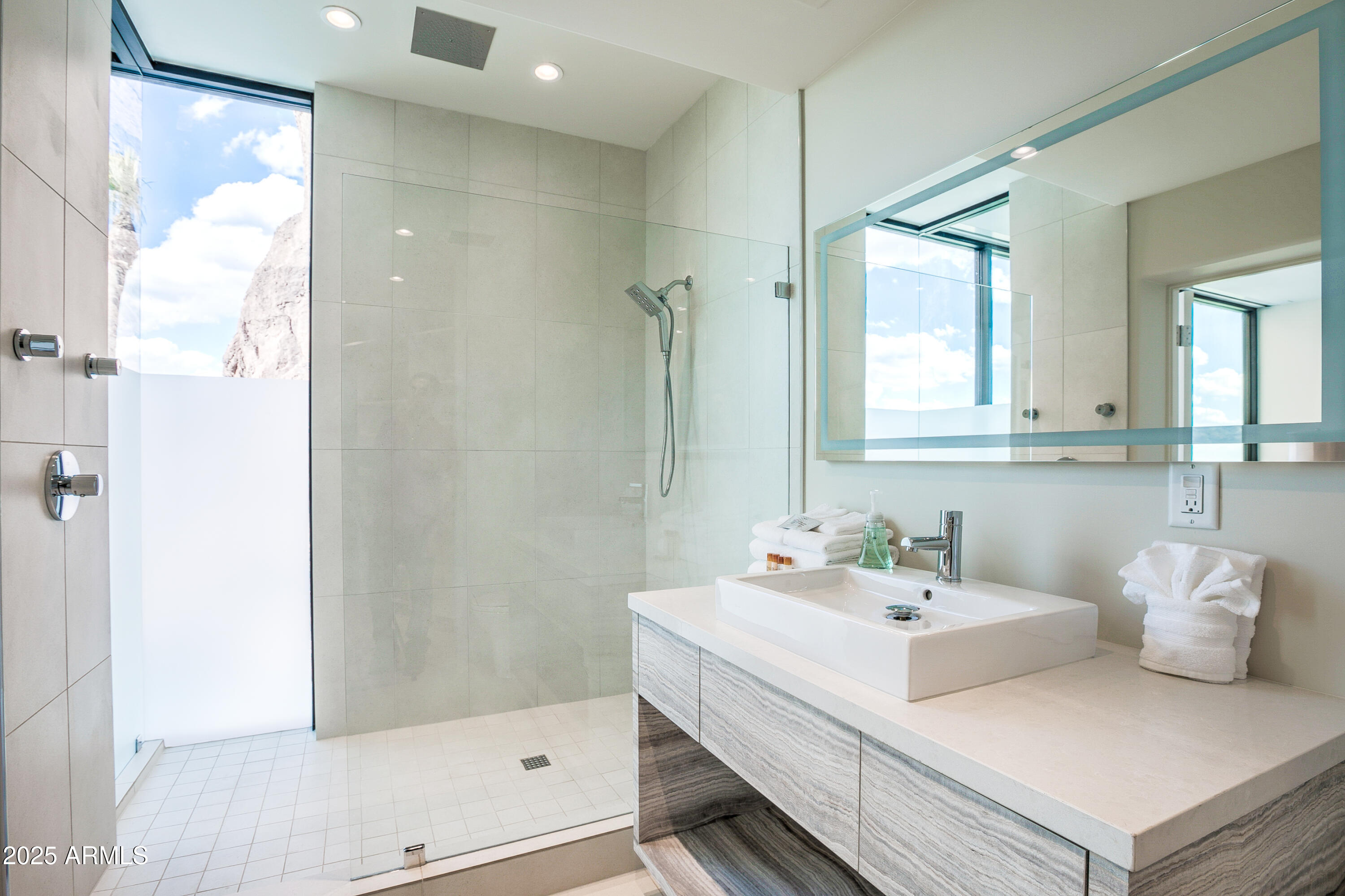 5302 North 47th Street Phoenix, AZ 85018 - Photo 27 of 33 a bathroom with a sink and a mirror