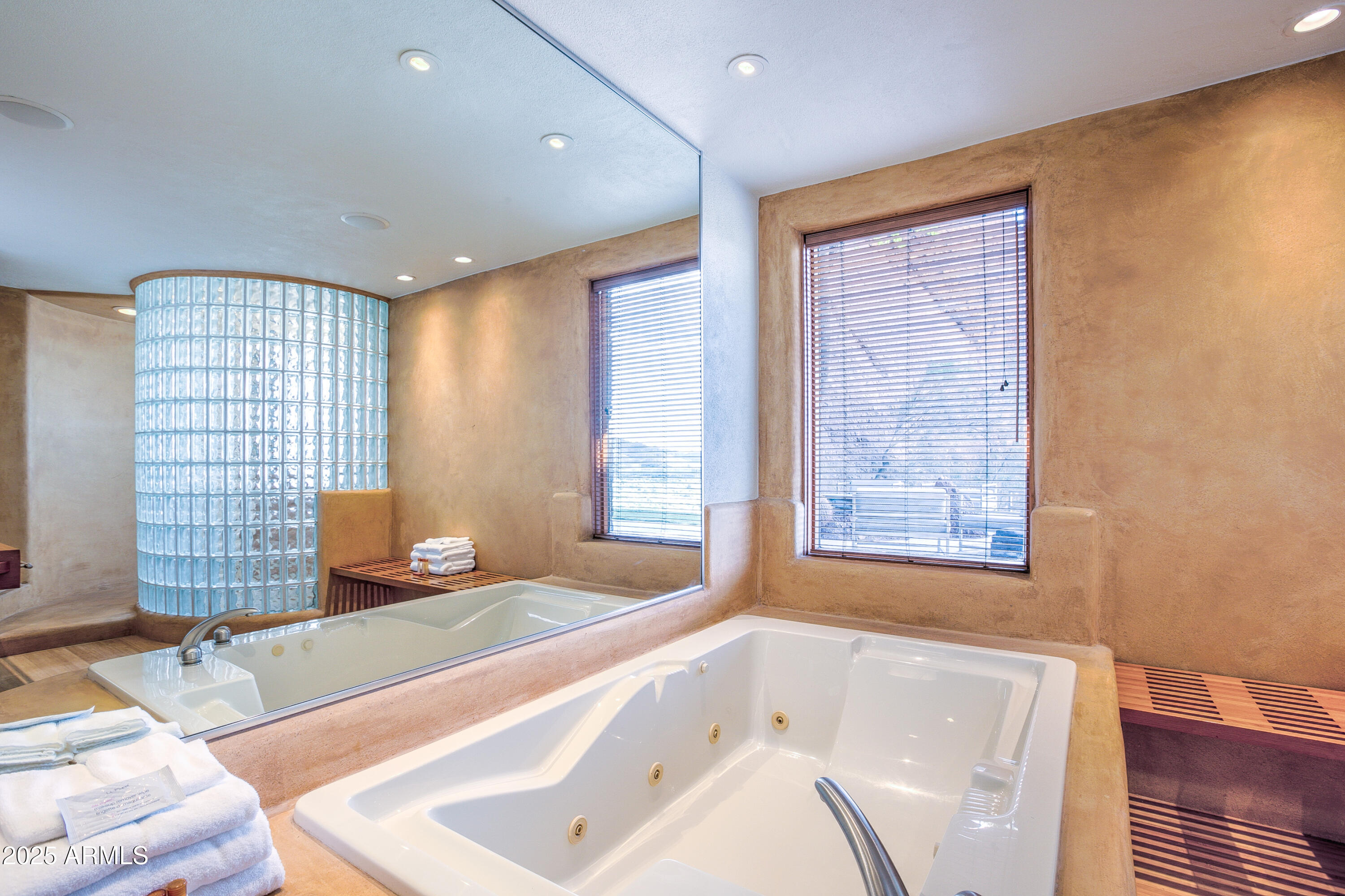 5302 North 47th Street Phoenix, AZ 85018 - Photo 28 of 33 a bathroom with a tub sink and mirror