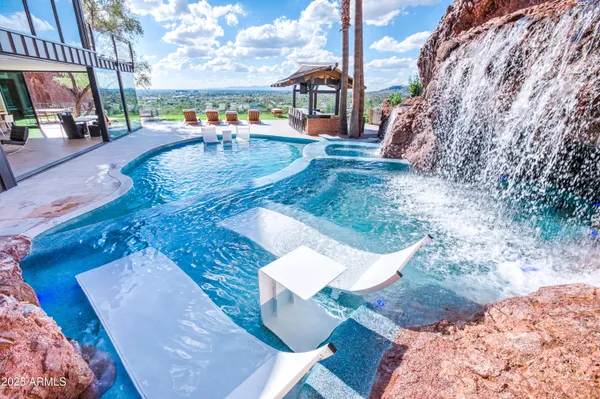 a view of a swimming pool with a patio