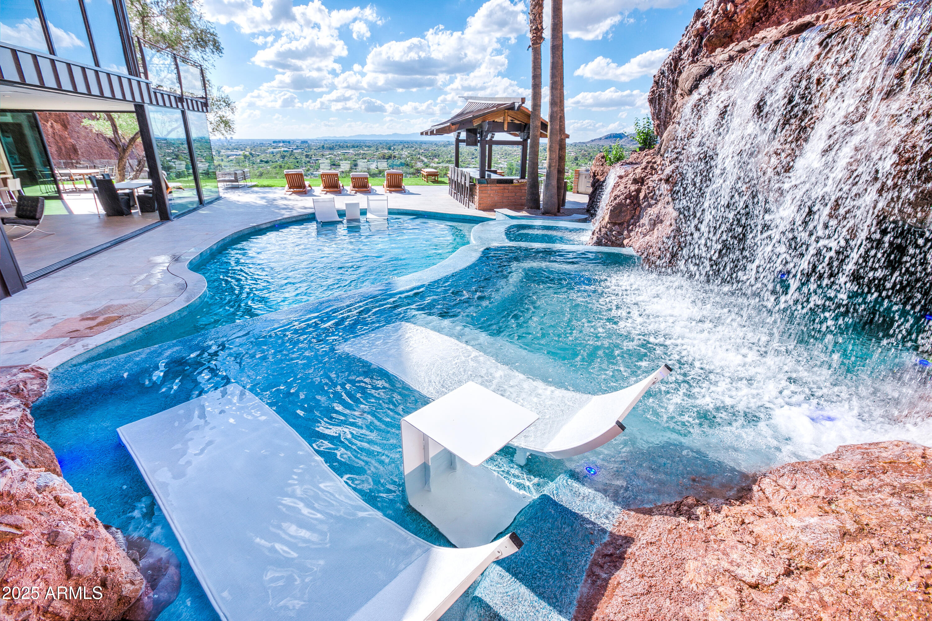 5302 North 47th Street Phoenix, AZ 85018 - Photo 3 of 33 a view of a swimming pool with a patio