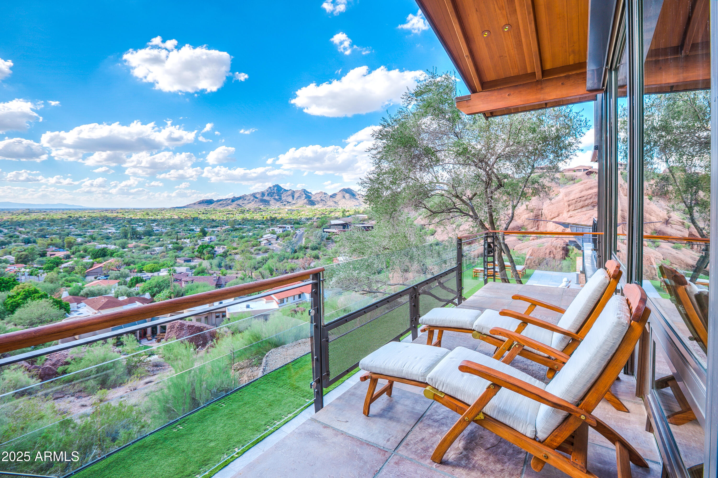 5302 North 47th Street Phoenix, AZ 85018 - Photo 9 of 33 a balcony with wooden floor and outdoor seating