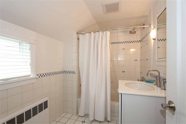 139 Richdale Road Needham, MA 02494 - Photo 23 of 25 a bathroom with a sink a mirror and a shower