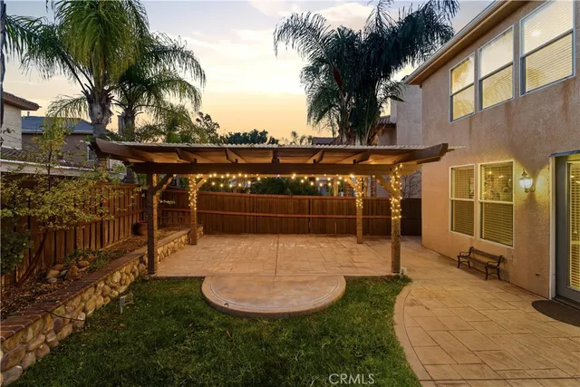 a view of a swimming pool with a chair and tables