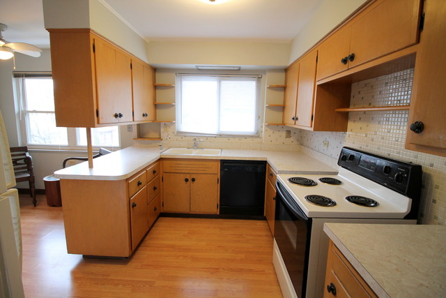 66 Lincoln Avenue Riverside, IL 60546 - Photo 8 of 25 a kitchen with a sink stove and cabinets