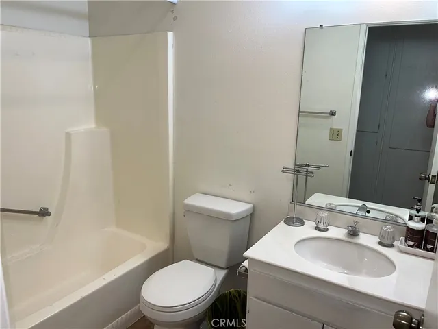 a bathroom with a toilet a sink and a bathtub