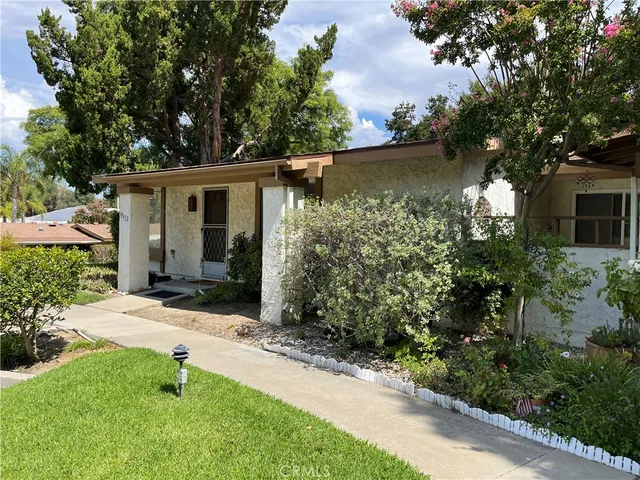 a view of a backyard of the house