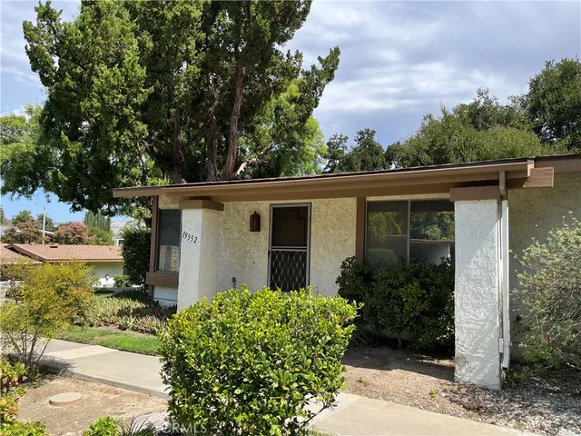 front view of a house with a garden