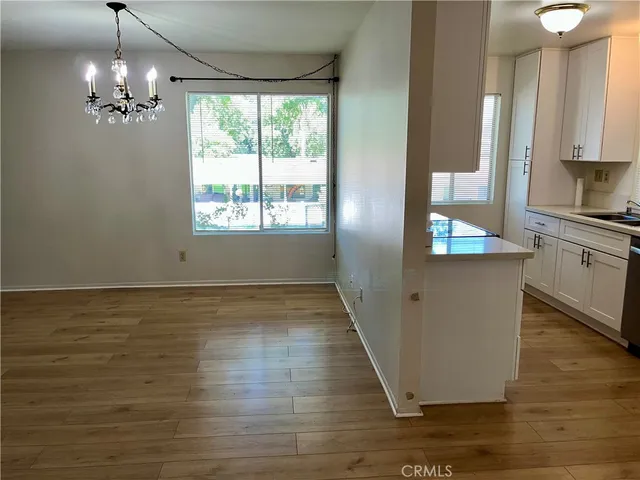 a view of a kitchen from the hallway