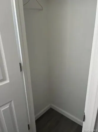 a kitchen with a refrigerator and a stove top oven