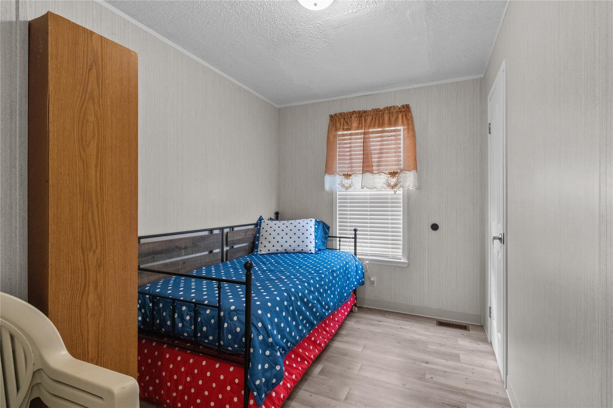 845 County Road 281 Sargent, TX 77414 - Photo 18 of 22 a bedroom with a bed and window