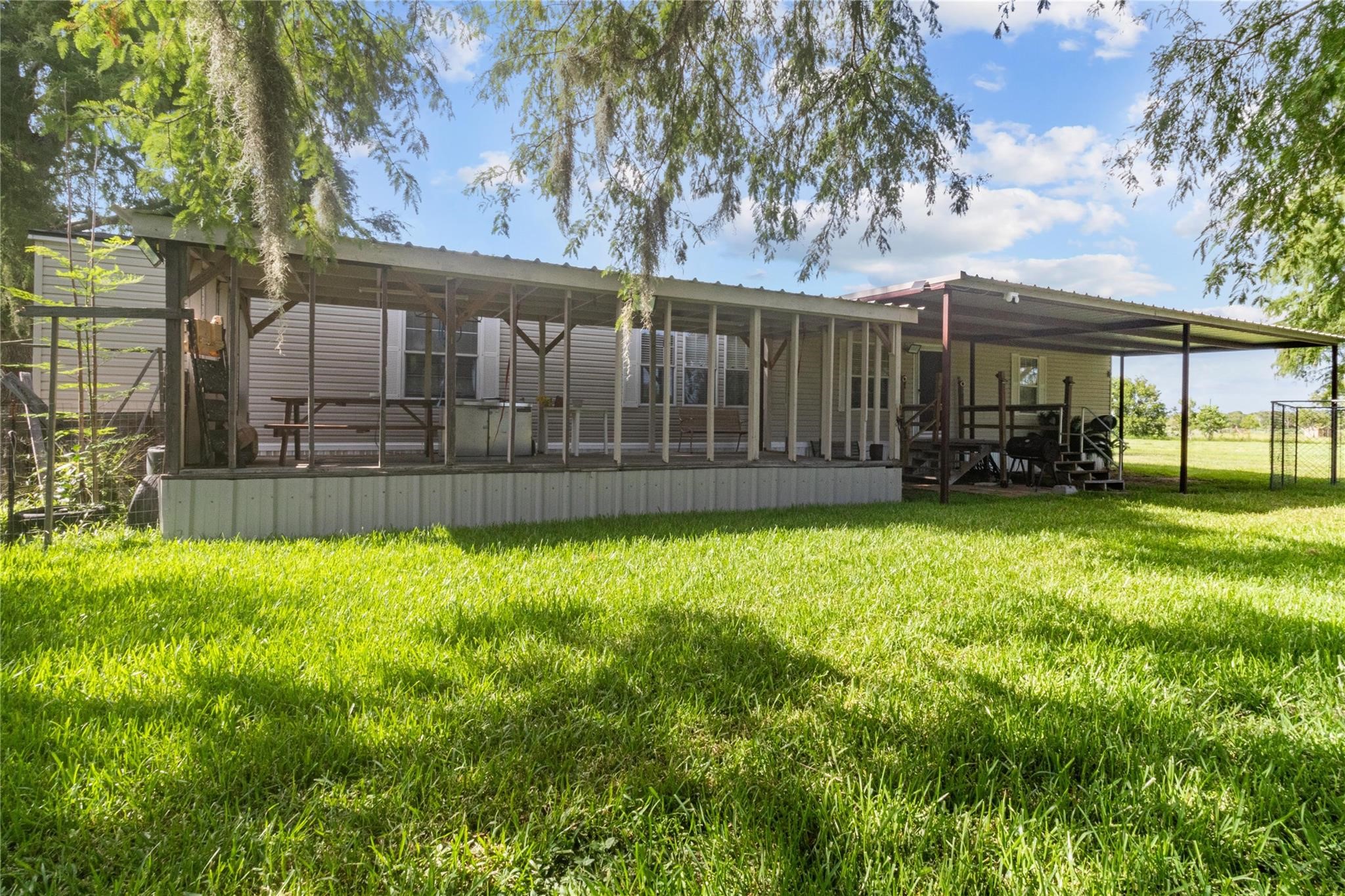 845 County Road 281 Sargent, TX 77414 - Photo 7 of 22 a view of a backyard with a garden
