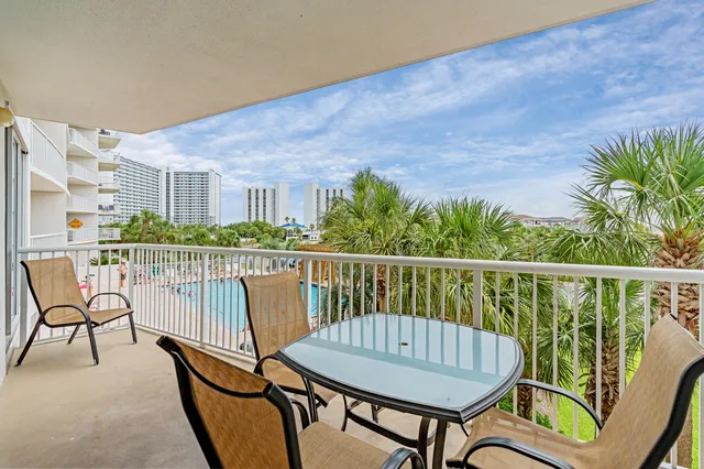 a view of a balcony with chairs