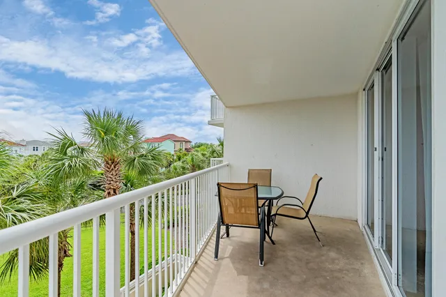 a view of a balcony with furniture