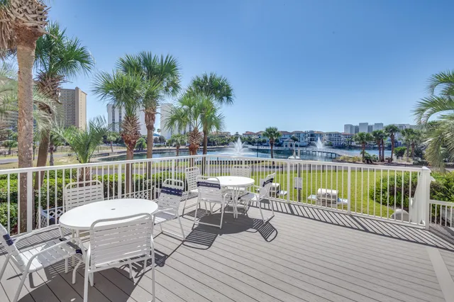 a view of a lake with a table and chairs