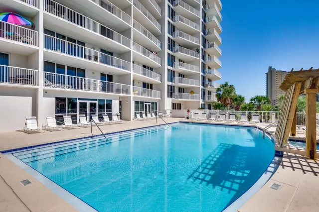 a view of a swimming pool with a lounge chairs