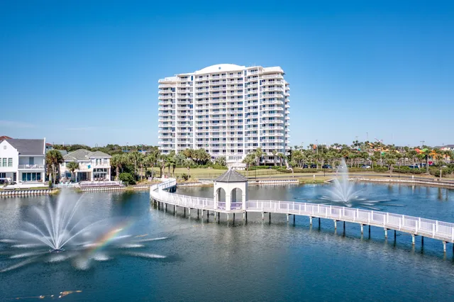 a view of residential houses with outdoor space and lake view