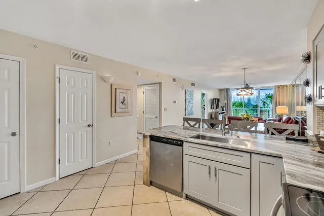 a kitchen with stainless steel appliances granite countertop a sink and cabinets