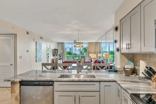 a kitchen with counter top space a sink and cabinets