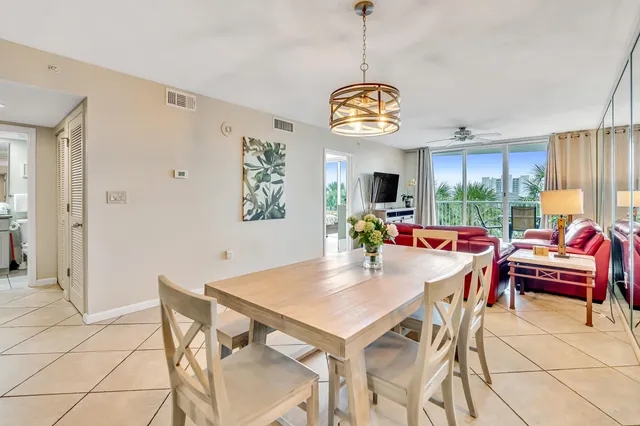 a view of a dining room and hall with furniture