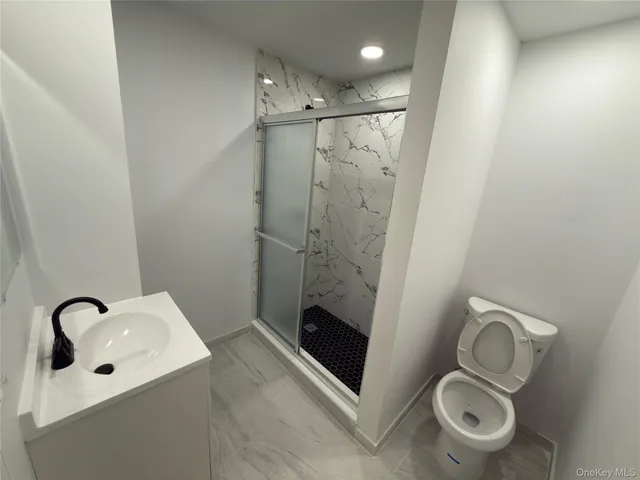 a bathroom with a shower and mirror