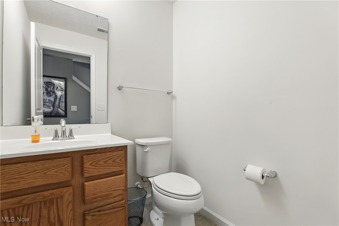 2112 Fowl Road Elyria, OH 44035 - Photo 37 of 49 Half bath with toilet and vanity