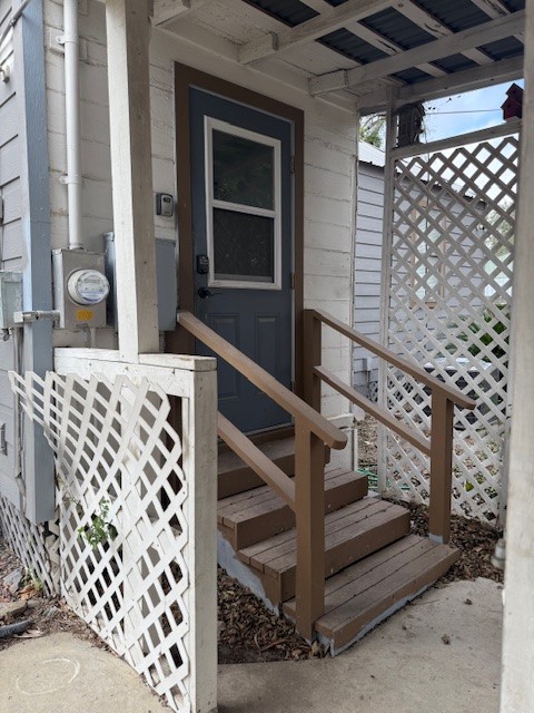 305 East Thornton Street Three Rivers, TX 78071 - Photo 15 of 15 a view of wooden door with a red gate
