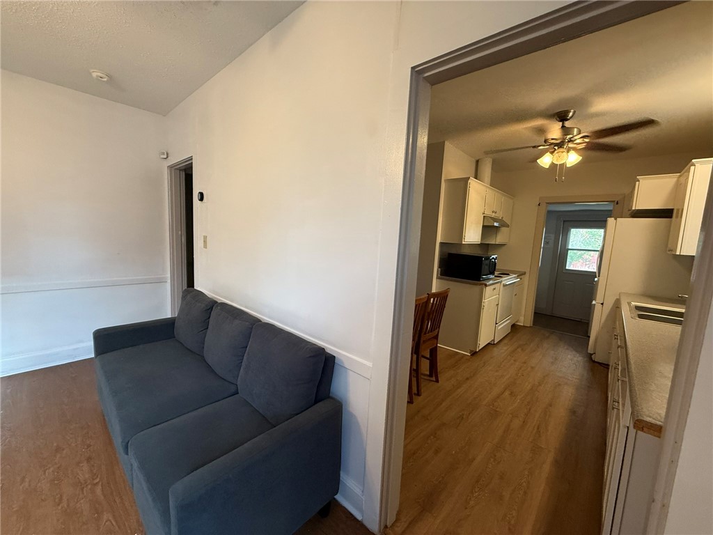305 East Thornton Street Three Rivers, TX 78071 - Photo 5 of 15 a living room with furniture and a chandelier