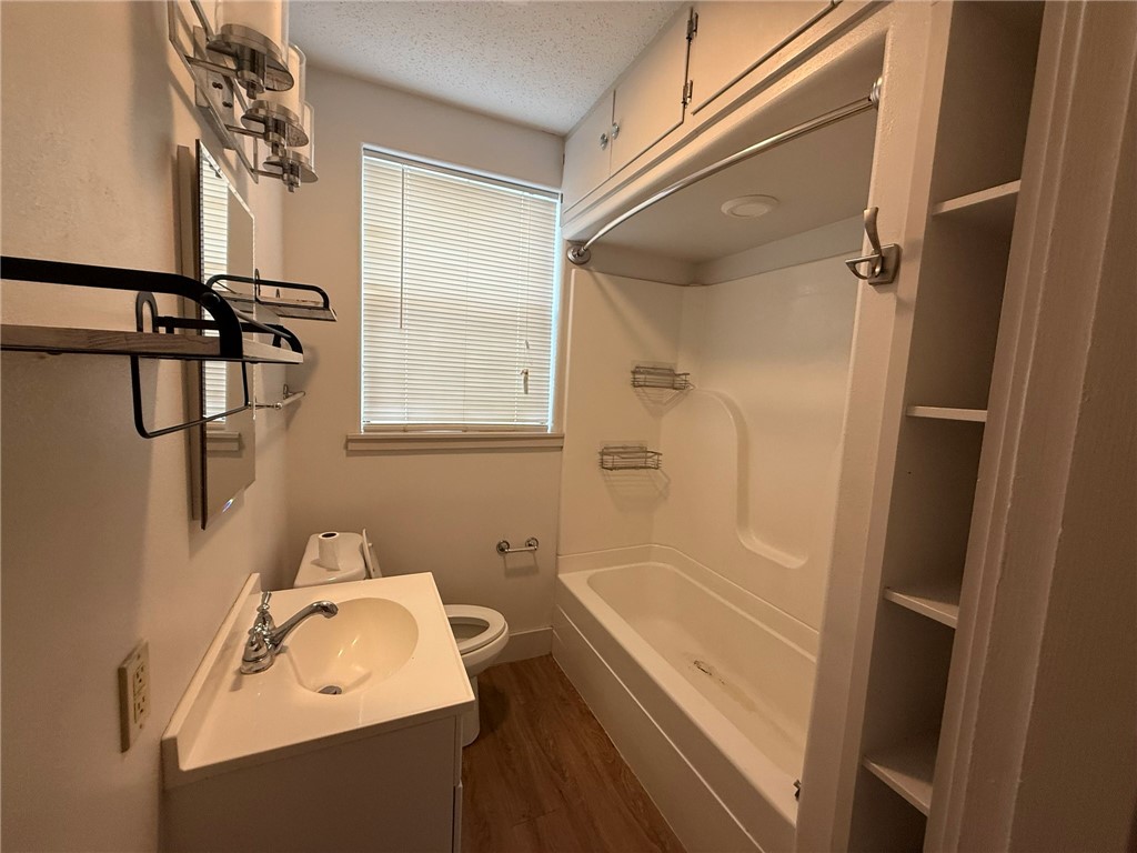 305 East Thornton Street Three Rivers, TX 78071 - Photo 9 of 15 a bathroom with a sink a bathtub and shower
