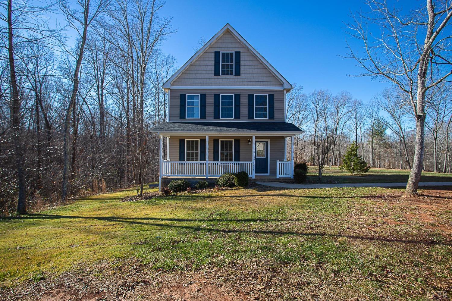 2417 River Road Madison Heights, VA 24572 - Photo 1 of 35 a front view of a house with a yard