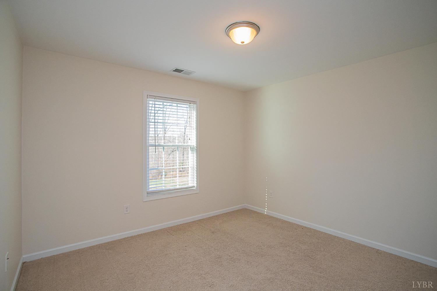2417 River Road Madison Heights, VA 24572 - Photo 12 of 35 an empty room with a window