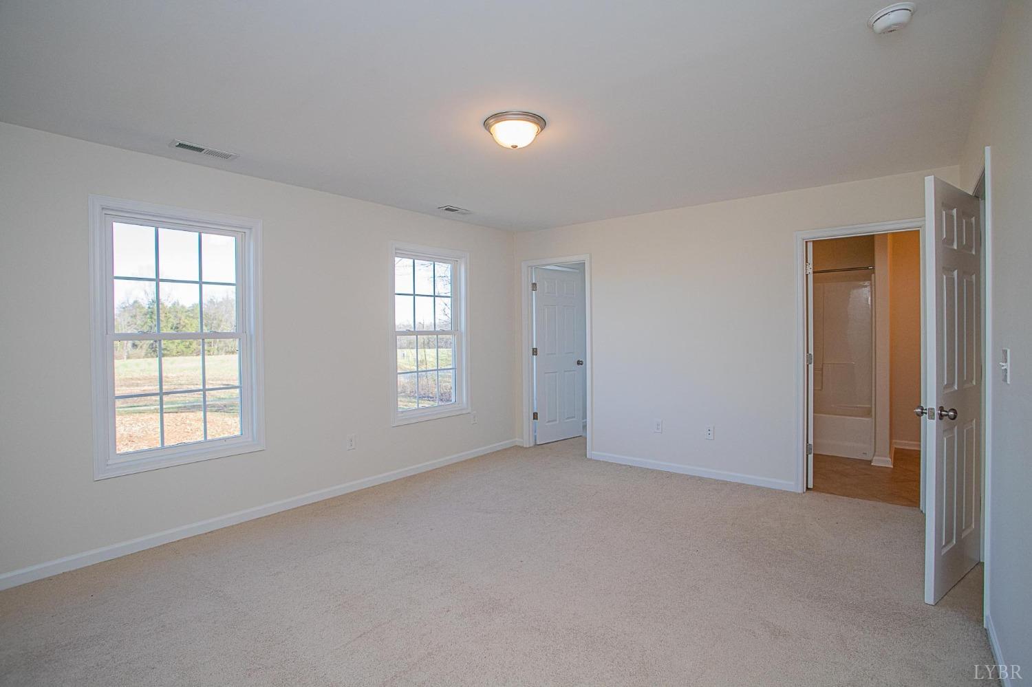 2417 River Road Madison Heights, VA 24572 - Photo 15 of 35 an empty room with windows and closet
