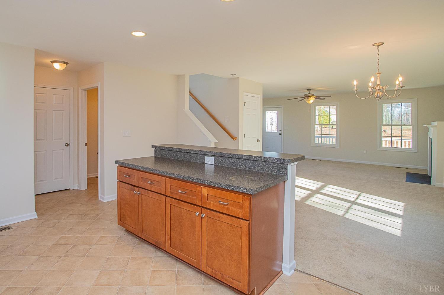 2417 River Road Madison Heights, VA 24572 - Photo 26 of 35 a kitchen with stainless steel appliances granite countertop a sink a stove and a refrigerator