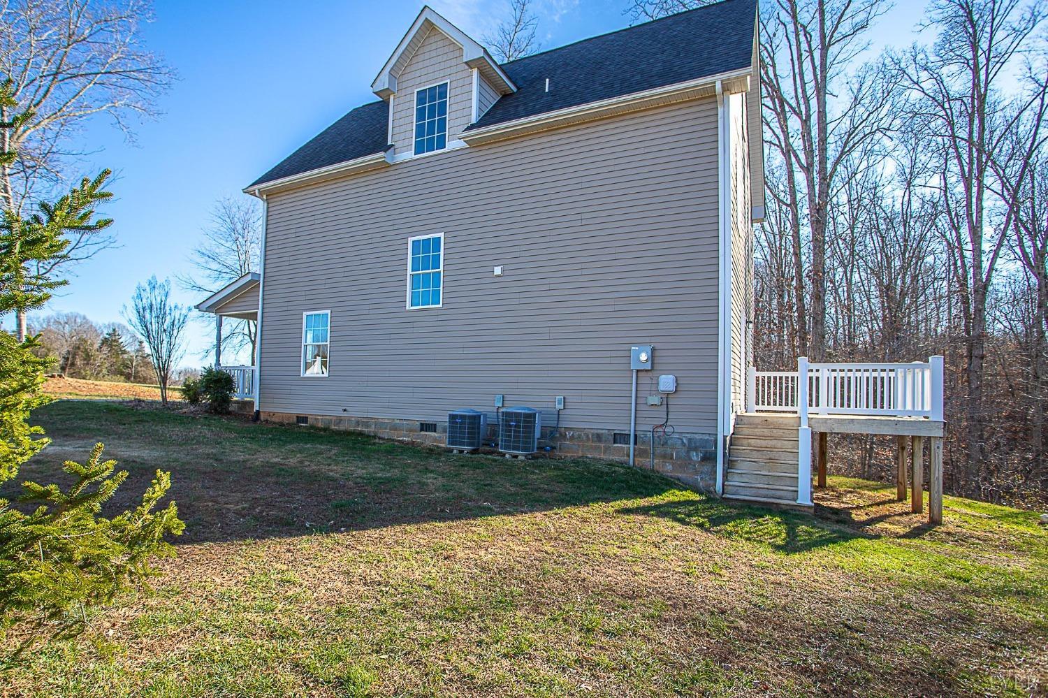 2417 River Road Madison Heights, VA 24572 - Photo 31 of 35 a backyard of a house with wooden fence and a tree