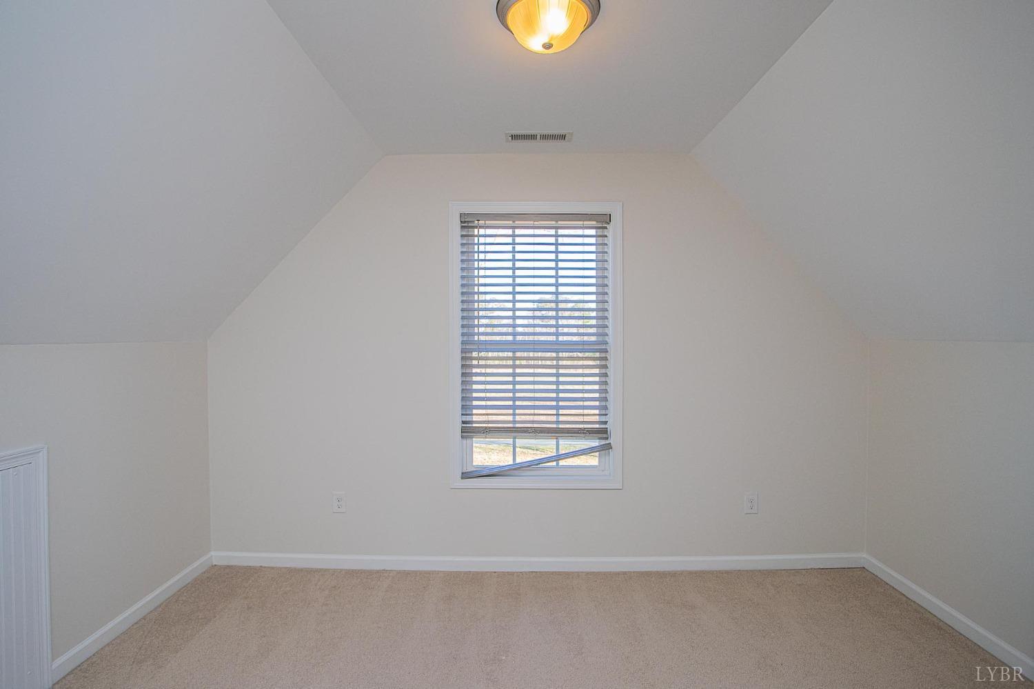 2417 River Road Madison Heights, VA 24572 - Photo 9 of 35 a view of an empty room with a window