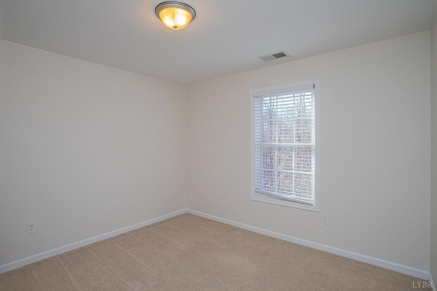 2417 River Road Madison Heights, VA 24572 - Photo 10 of 35 an empty room with a window