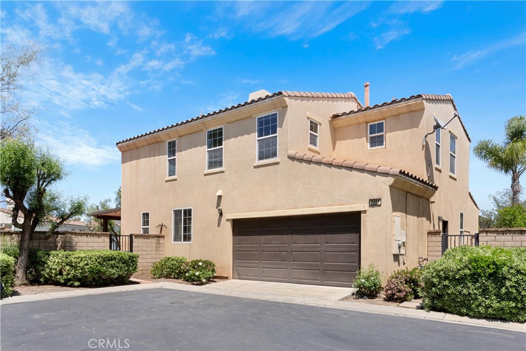 a front view of a house with a garage