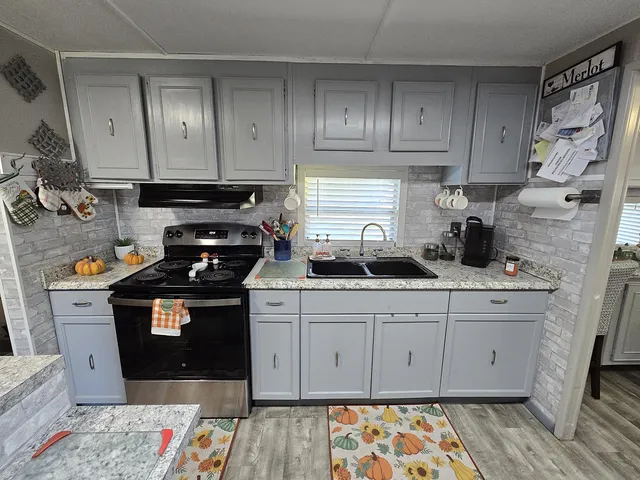 a dining room with furniture and a window