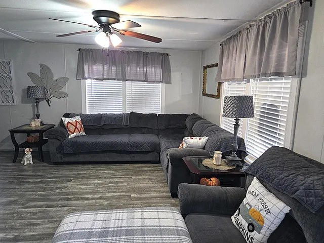 a living room with furniture and a window