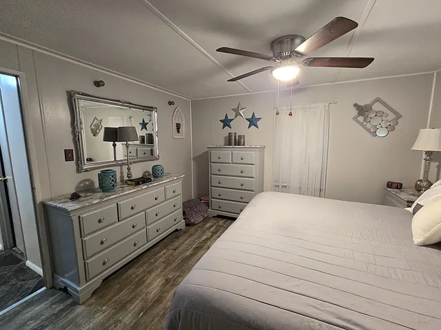 a view of a house with a yard potted plants