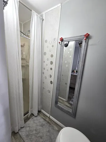 a view of a patio with table and chairs and potted plants