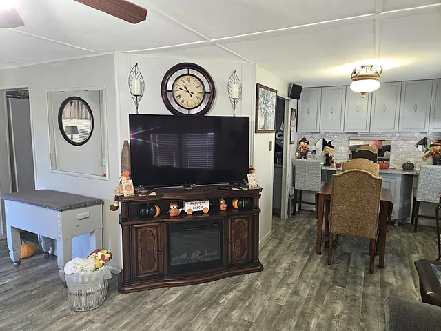 a kitchen with appliances a sink and cabinets