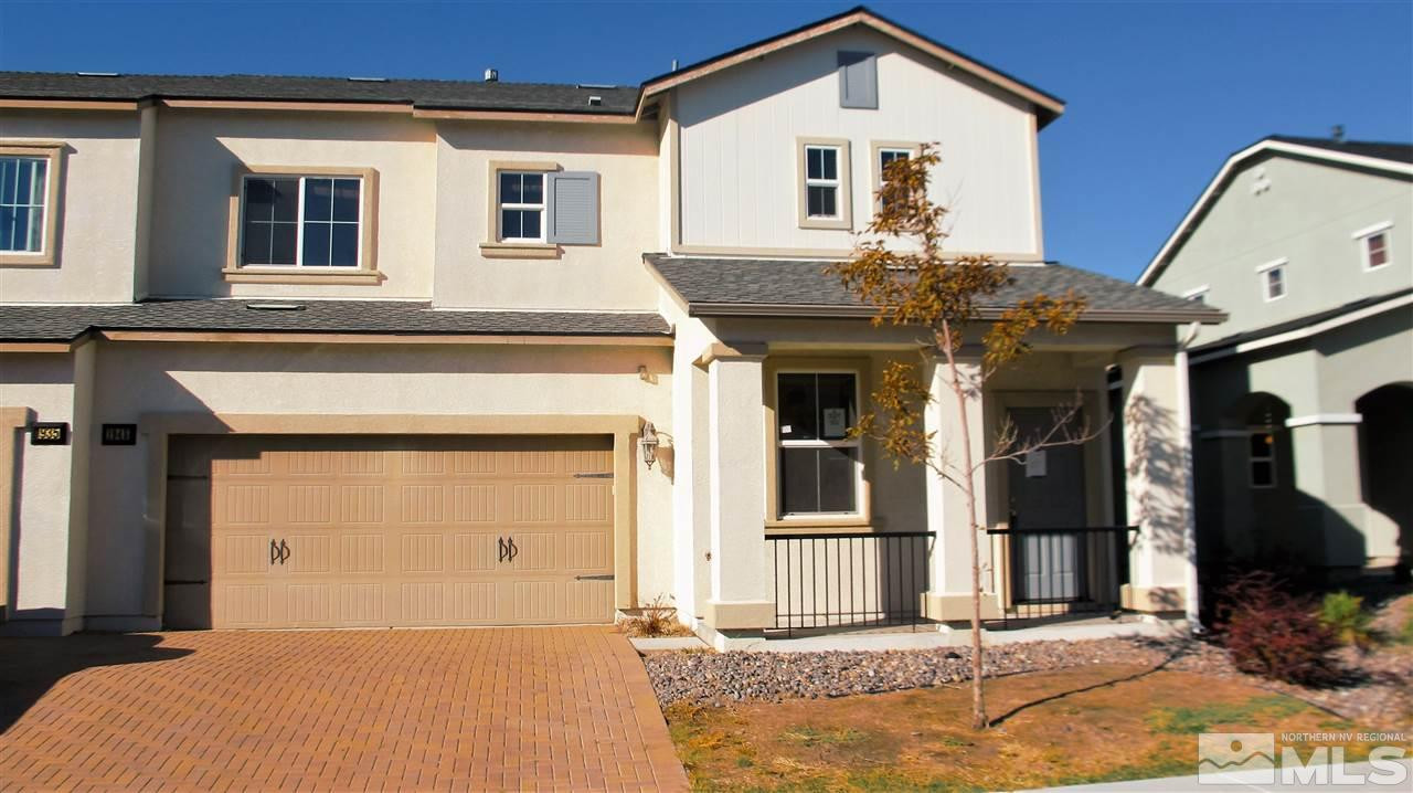 a front view of a house with a garage