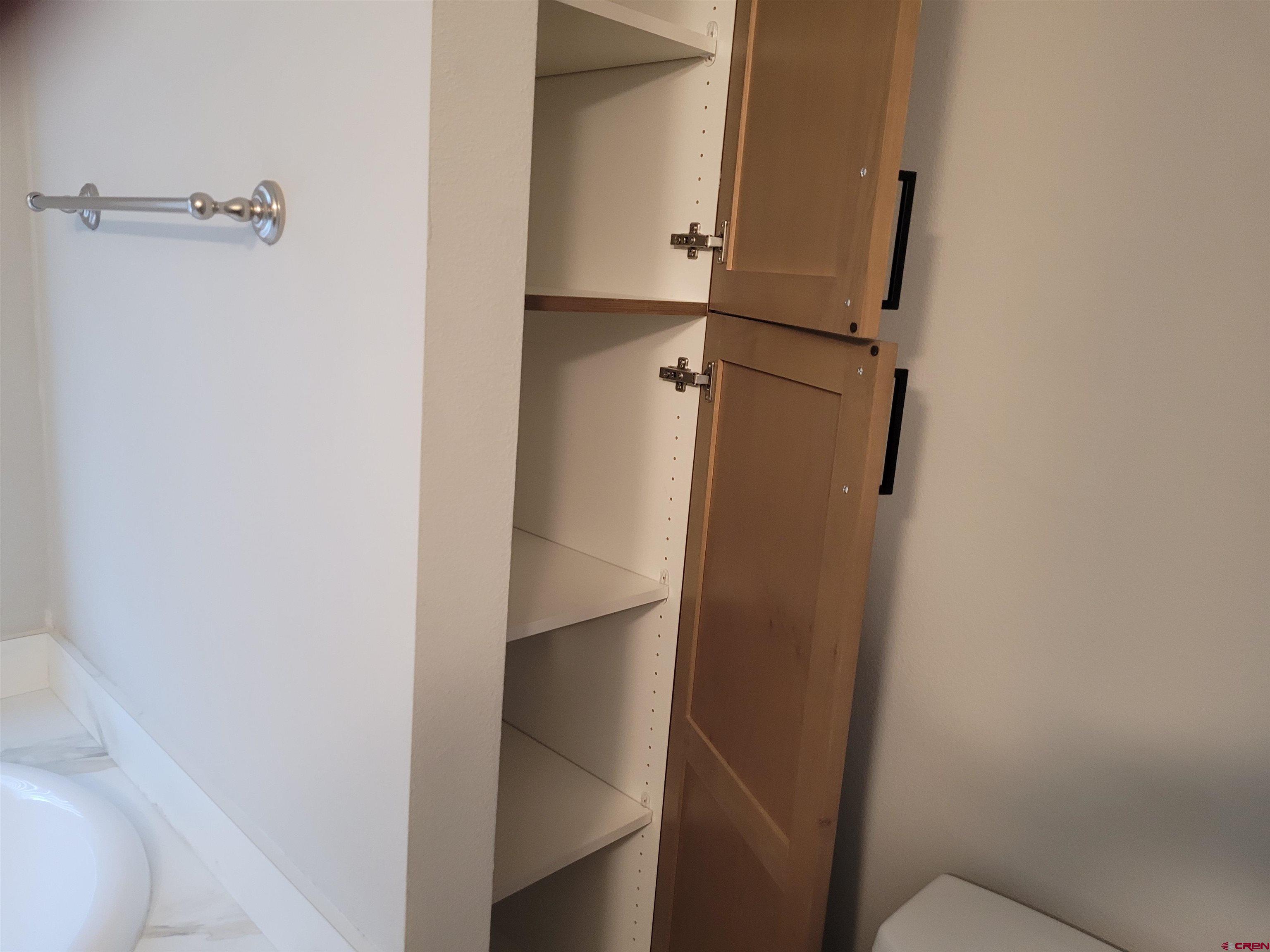 305 9th Street Saguache, CO 81149 - Photo 11 of 32 a bathroom with a shower