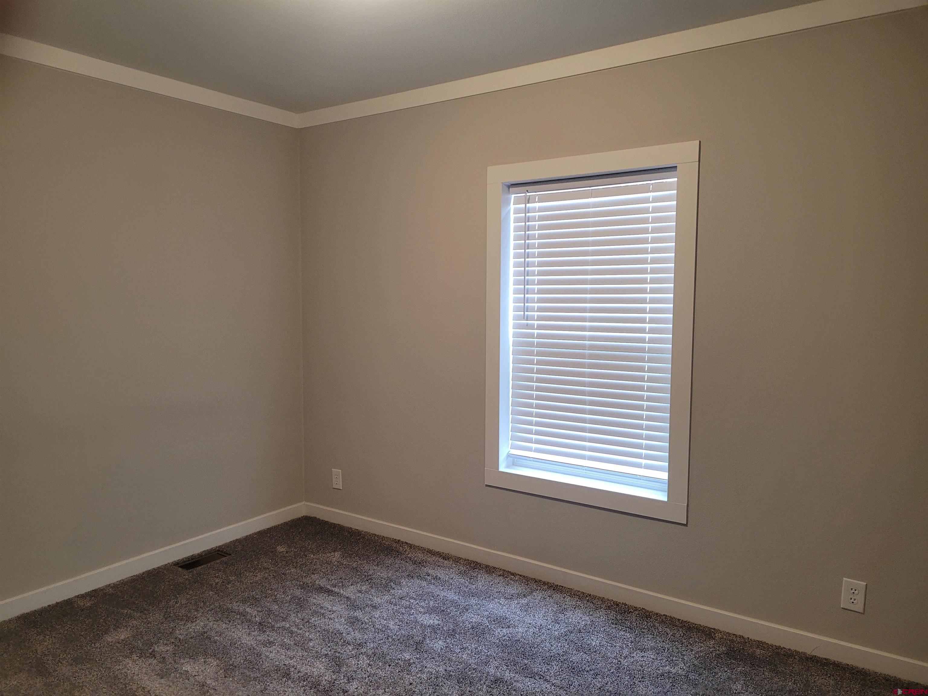305 9th Street Saguache, CO 81149 - Photo 14 of 32 an empty room with a window
