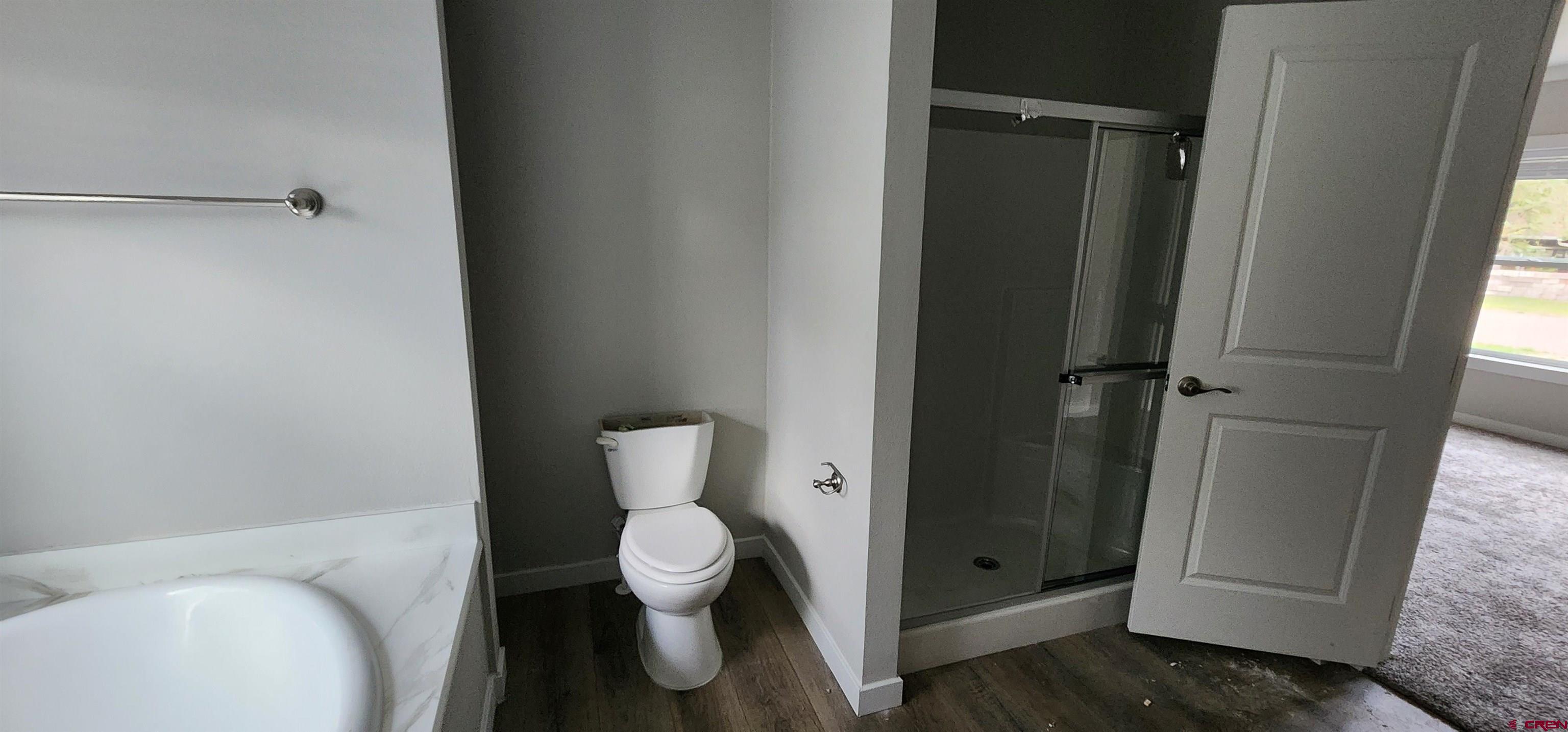 305 9th Street Saguache, CO 81149 - Photo 20 of 32 a white toilet sitting next to a bathroom sink
