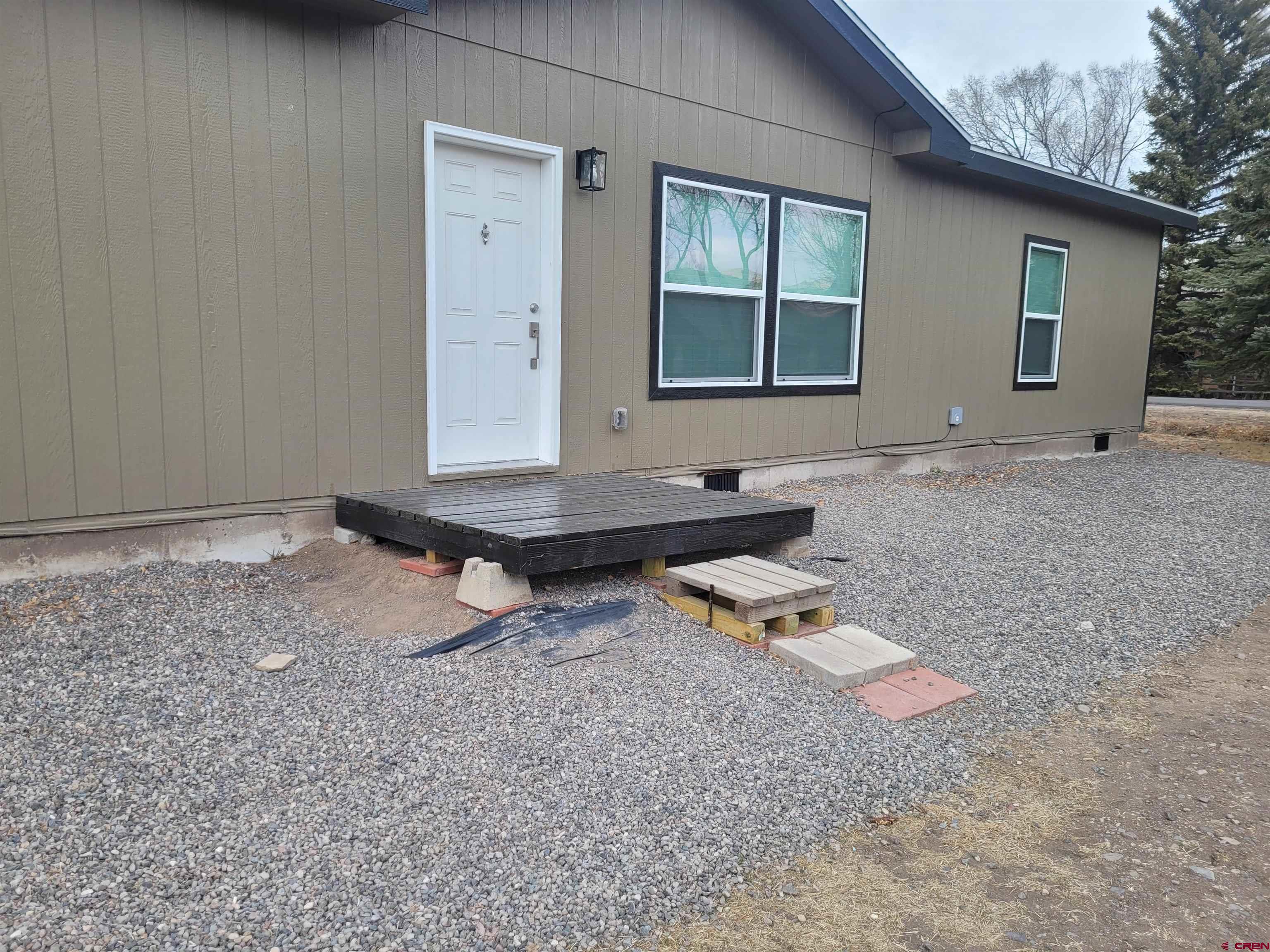 305 9th Street Saguache, CO 81149 - Photo 21 of 32 a backyard of a house with barbeque oven table and chairs