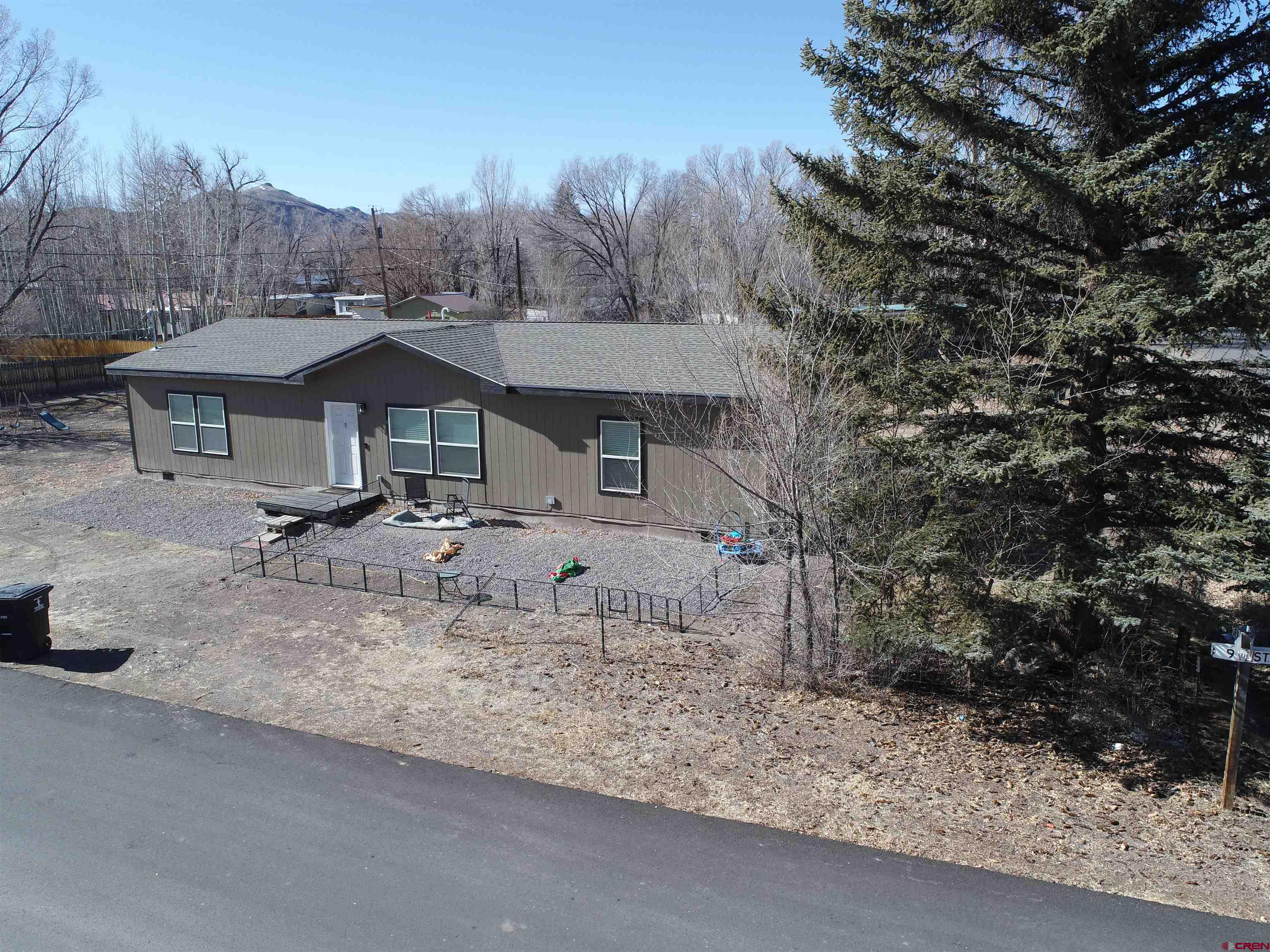 305 9th Street Saguache, CO 81149 - Photo 31 of 32 a backyard of a house with table and chairs