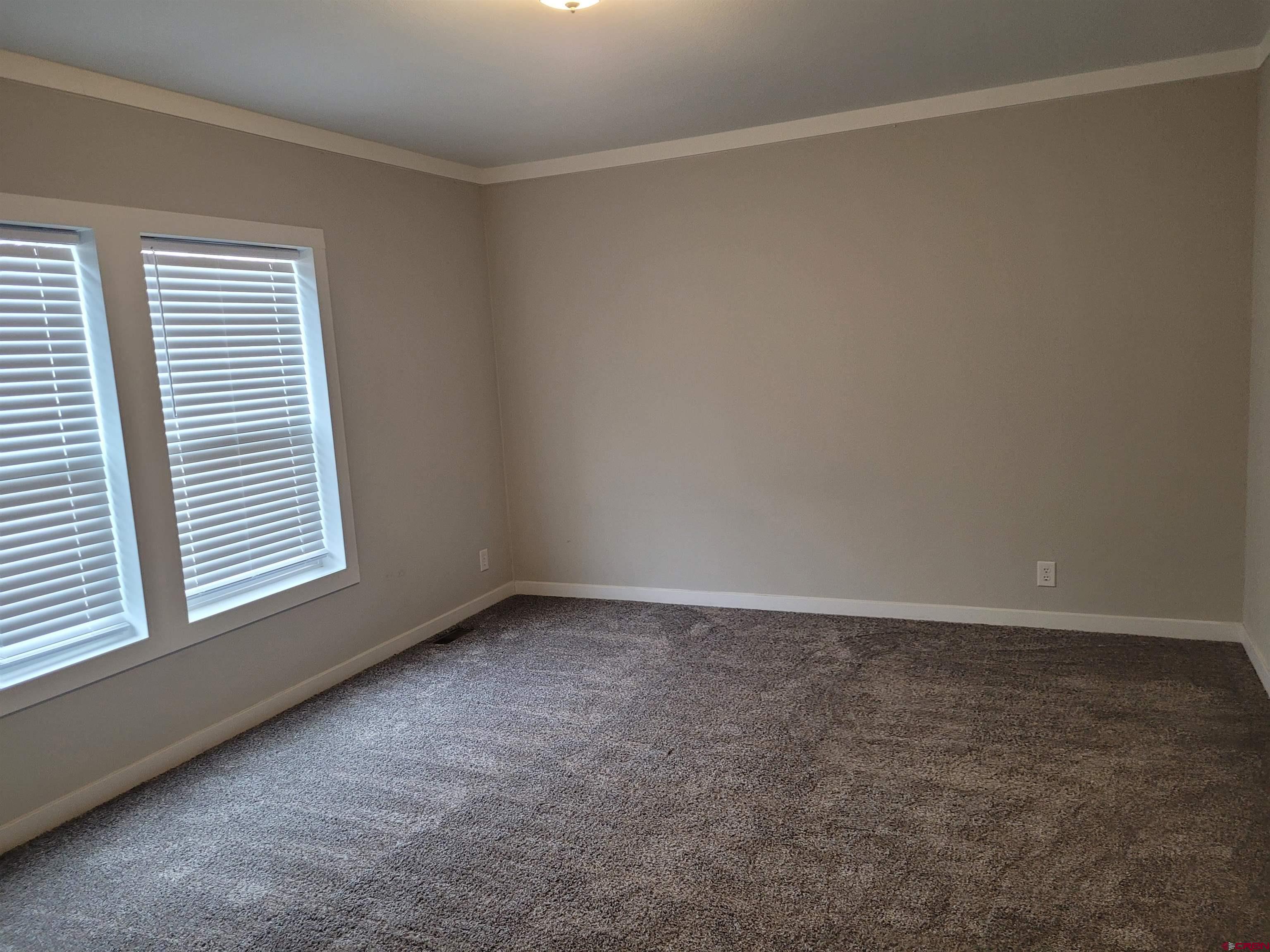 305 9th Street Saguache, CO 81149 - Photo 6 of 32 an empty room with a window