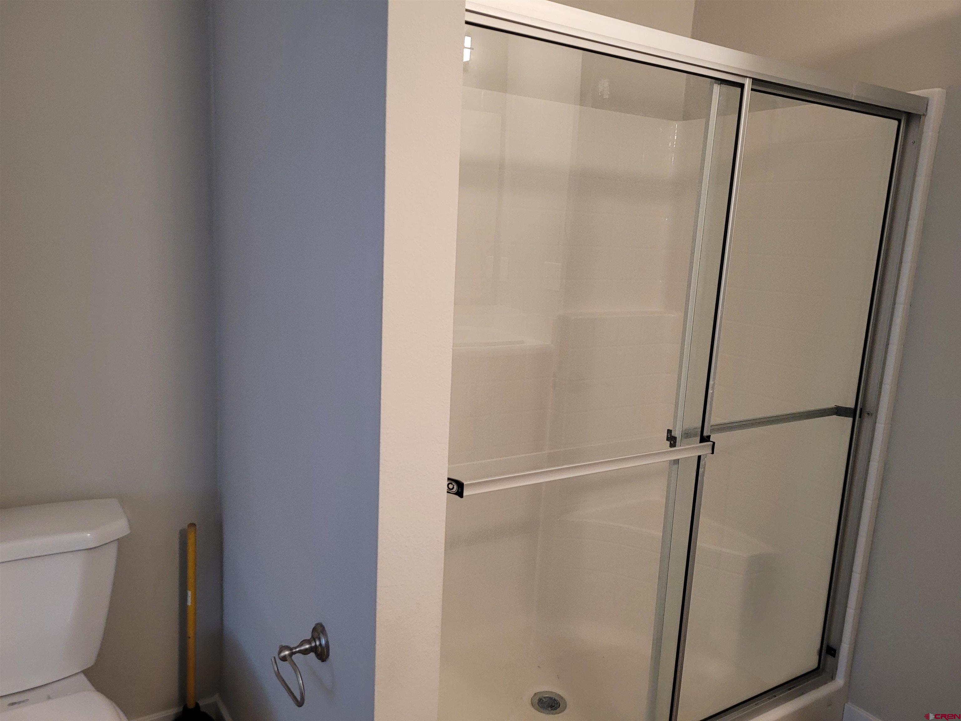 305 9th Street Saguache, CO 81149 - Photo 8 of 32 a bathroom with a shower and a toilet